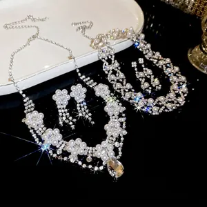Luxury floral crystal necklace and drop pearl earrings set with sparkling stones