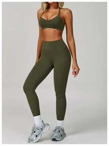 Close-up of olive green V-neck sports bra and high-waist yoga leggings set detail