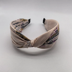 Elegant color-block crisscross headband with soft silk texture and abstract stripe patterns