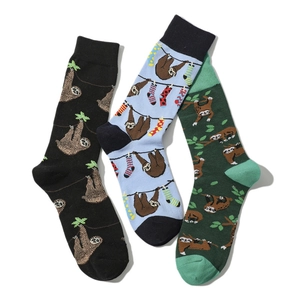 Detailed trio pack of crew socks with colorful sloth cartoon patterns on cotton fabric