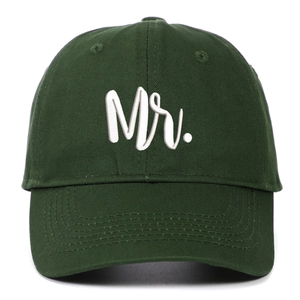 Close-up of white 3D embroidered Mr text on dark green cotton baseball cap details