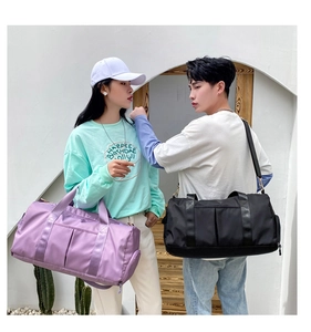 Black and purple waterproof nylon travel bags shown in a lifestyle couple outdoor setting