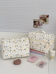Quilted floral corduroy makeup bag set with almond yellow flowers in a 2-piece portable kit