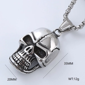 Macro shot of a silver gothic skull pendant showing 35mm height and 20mm width dimensions