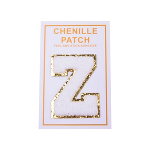 Detail of white chenille letter Z patch with gold glitter edge and peel and stick back
