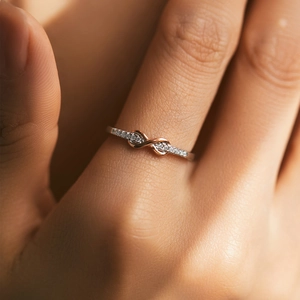 Sparkling S925 silver infinity mobius ring with micro-pave crystals on female hand