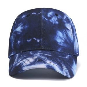 Detail of blue and white tie-dye cotton baseball cap with reinforced curved brim