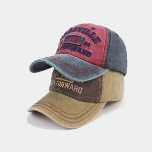 Detail of washed cotton baseball caps with vintage NYS embroidery and distressed finish