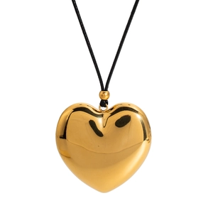 Polished 18K gold-plated hollow heart pendant necklace with a black cord on white background
