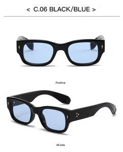 Detail of rectangular black frame sunglasses with blue lenses and silver arrow rivets