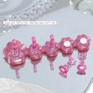 Macro shot of aurora pink cat-claw nail practice base with magnetic tip holders