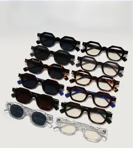 Close-up of retro polygonal sunglasses with thick frames and rivet details in various colors