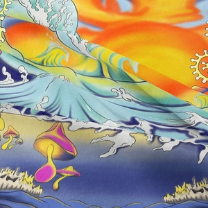 Detail shot of psychedelic tapestry featuring sun and mushroom patterns in pop art style