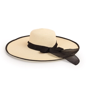 Detail of wide brim straw hat with woven texture and elegant black mesh bow ribbon