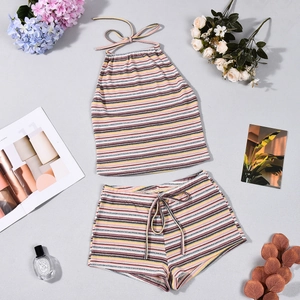 Flat lay of colorful striped knit two-piece set with halter neck top and elastic shorts