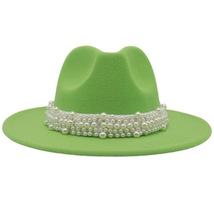 Close-up of bright green fedora hat featuring a white faux pearl decorative band detail