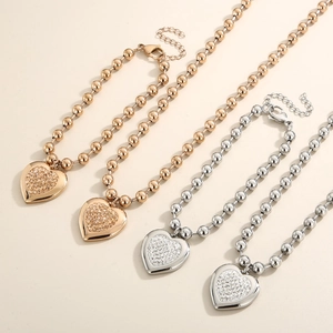 Women's heart pendant beaded necklaces in gold and silver finish with sparkling crystals