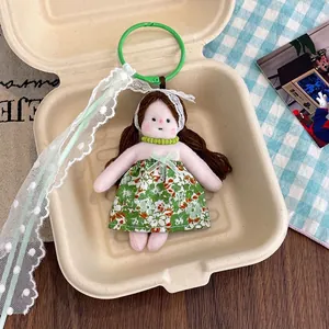 Detail of floral dress plush doll pendant with lace headband in a creative gift box