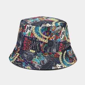 Close-up of retro street graffiti bucket hat with vintage cassette and boombox prints