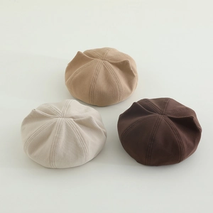 Three cute cat-ear berets for kids in beige, cream, and brown corduroy texture