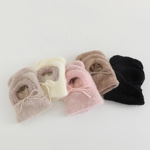 Detail of plush winter balaclava hats in five colors with drawstring bow knots