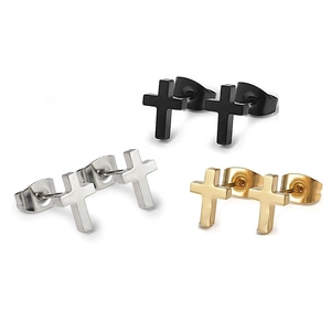 Detailed view of cross stud earrings in black, silver, and gold stainless steel finishes