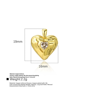 Detailed close-up showing the 19mm gold heart pendant with textured surface and zircon