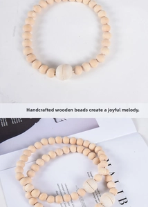 Detail of Nordic wooden bead curtain tieback with natural wood texture and smooth finish