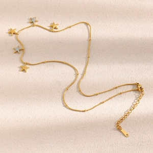 Detail of adjustable 18K gold plated bead chain with multiple starfish pendants