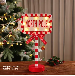Detail of wooden North Pole LED sign with dimensions 28.5cm height and 15.5cm width