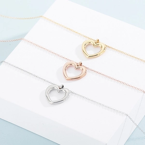 Three-piece hollow heart necklaces in gold, rose gold, and silver stainless steel