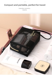 Detailed view of black mesh makeup bag with golden Fashion Girl text in a pink suitcase