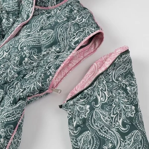 Detail view of the detachable sleeve zipper on women's paisley print cotton jacket