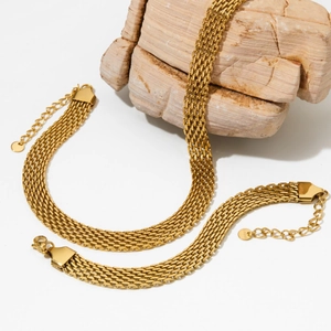 Chic 10mm gold mesh chain necklace set displayed on a minimalist beige stone texture