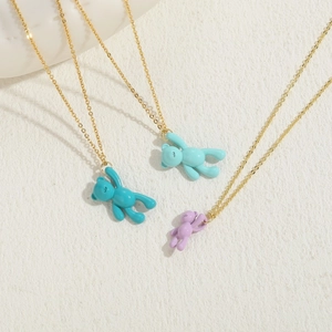 Three bear pendant necklaces in teal, mint, and purple on fine gold chains