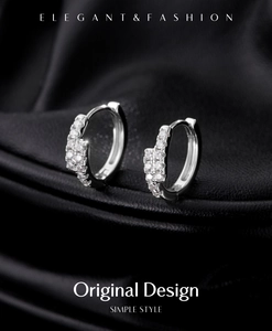 Macro shot of silver S925 earrings with double-row sparkling Moissanite stones