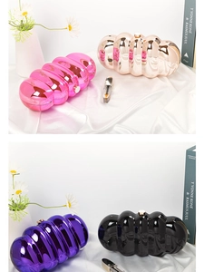 Close-up of metallic wave-texture cloud bags in pink, rose gold, purple, and black