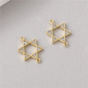 Macro detail of gold hexagram pendant with clear zircons and double hanging rings