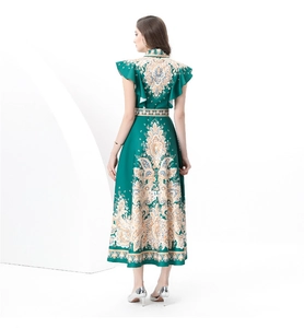 Rear view of dark green vintage palace dress featuring gold floral prints and a waist belt