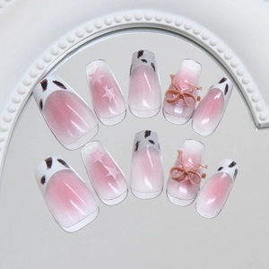 Pink cat eye press-on nails set with leopard print patterns and 3D bowknot accents
