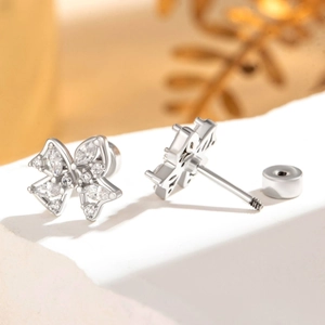 Silver bow stud earrings in titanium steel with sparkling cubic zirconia inlay