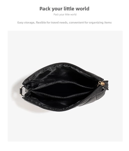Detail view of the multi-compartment interior and quilted embroidery on the crossbody bag