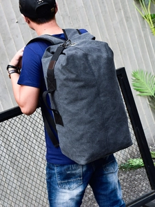 Large dark grey canvas travel backpack for men featuring a minimalist outdoor sports design