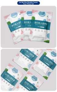 Detailed view of individual packaging for disposable double four-piece travel bedding set