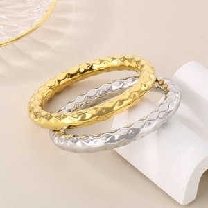 Minimalist stainless steel bangles with textured diamond pattern in gold and silver finish