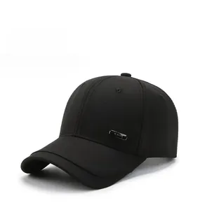 Detailed close-up of a black cotton baseball cap with silver metal HATS plaque decoration
