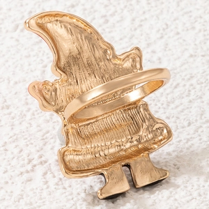 Close-up of golden Christmas Santa Claus ring showing metal texture and back detail