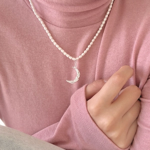 925 silver moon pendant necklace with delicate rice pearls shown on model's neck