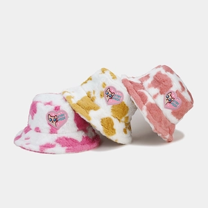 Fuzzy cow print bucket hats for women in pink and yellow with cute cat heart patches