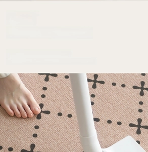 Close-up of retro French style carpet showing durable short pile fabric and abstract patterns